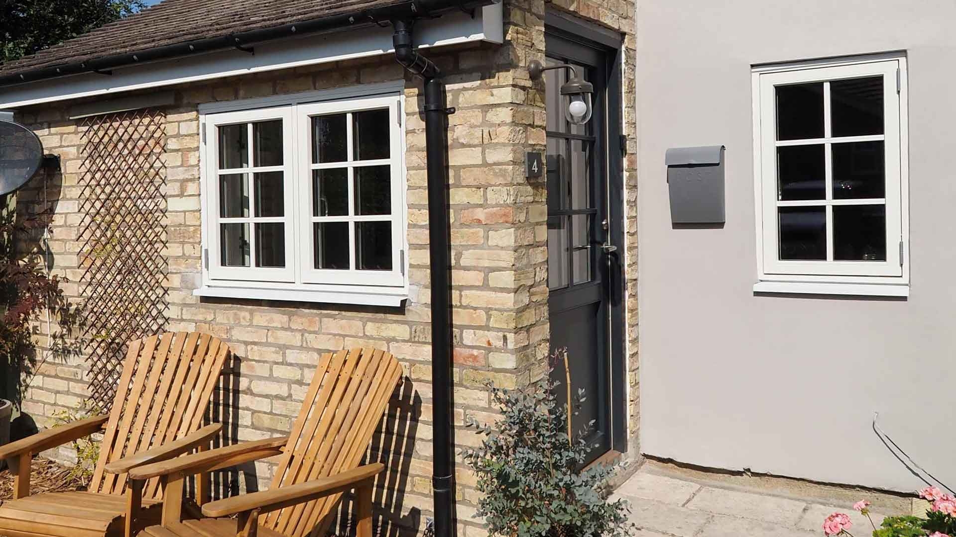 British cottage with windows and a new front door